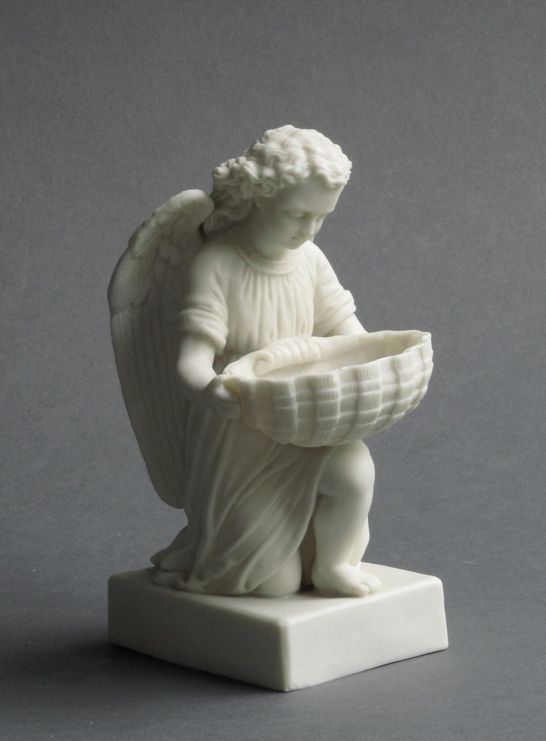 Parian ware angel and shell font