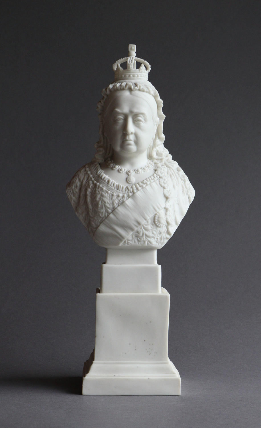 A small R&L Parian Diamond Jubilee bust of Queen Victoria on a plinth