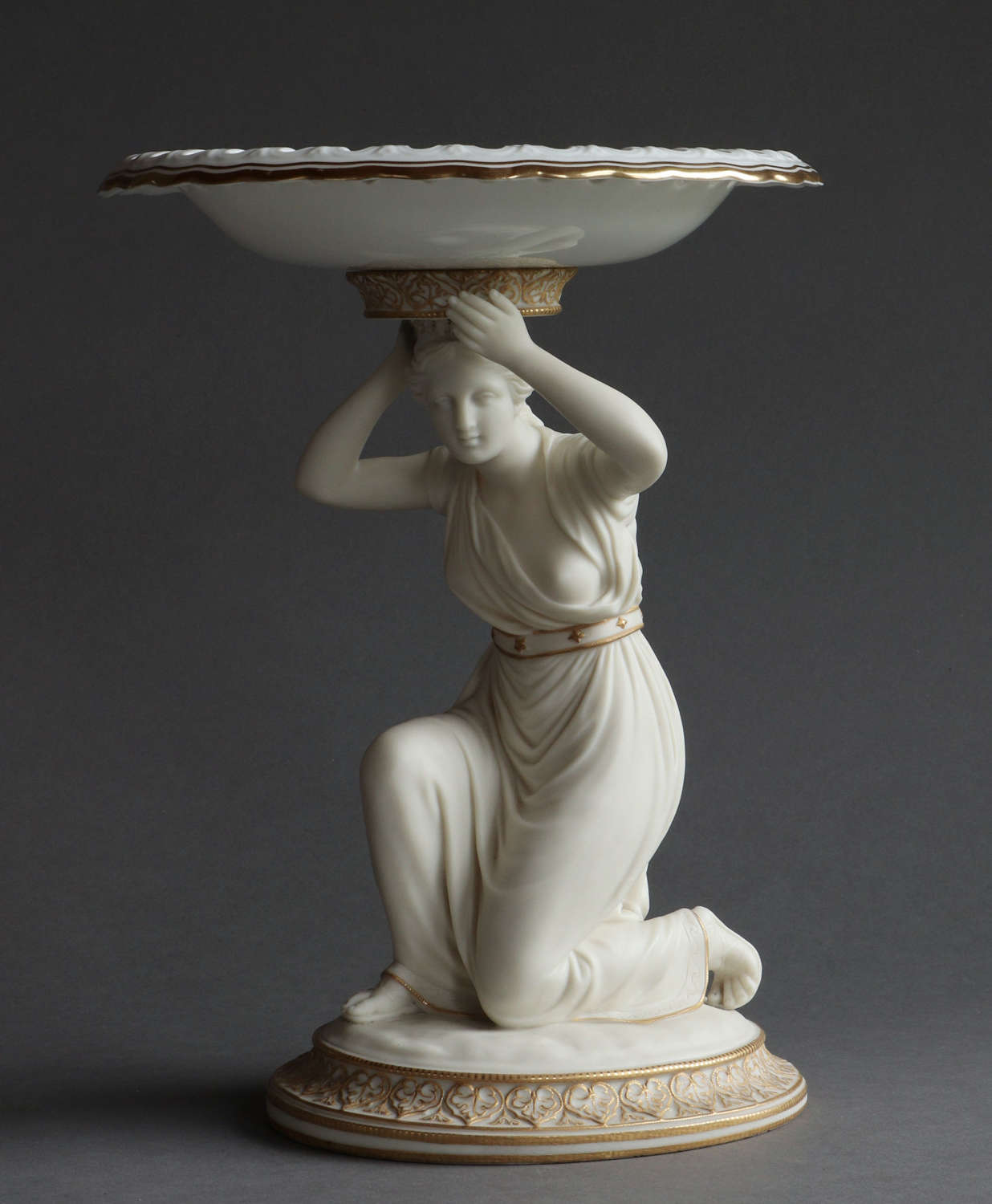 A Copeland Parian Comport with a kneeling woman