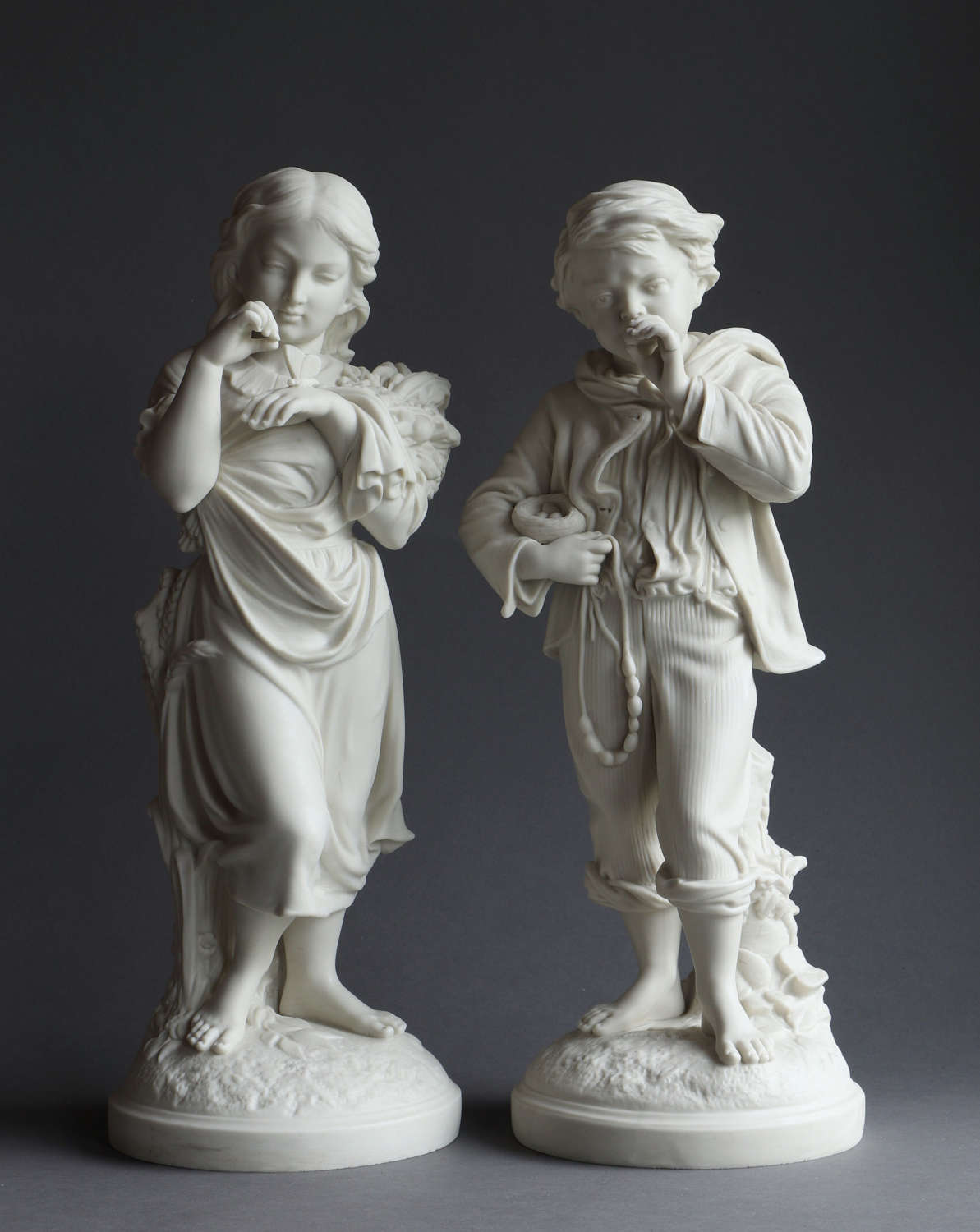 A charming pair of Copeland Parian figures: “Young Naturalists”