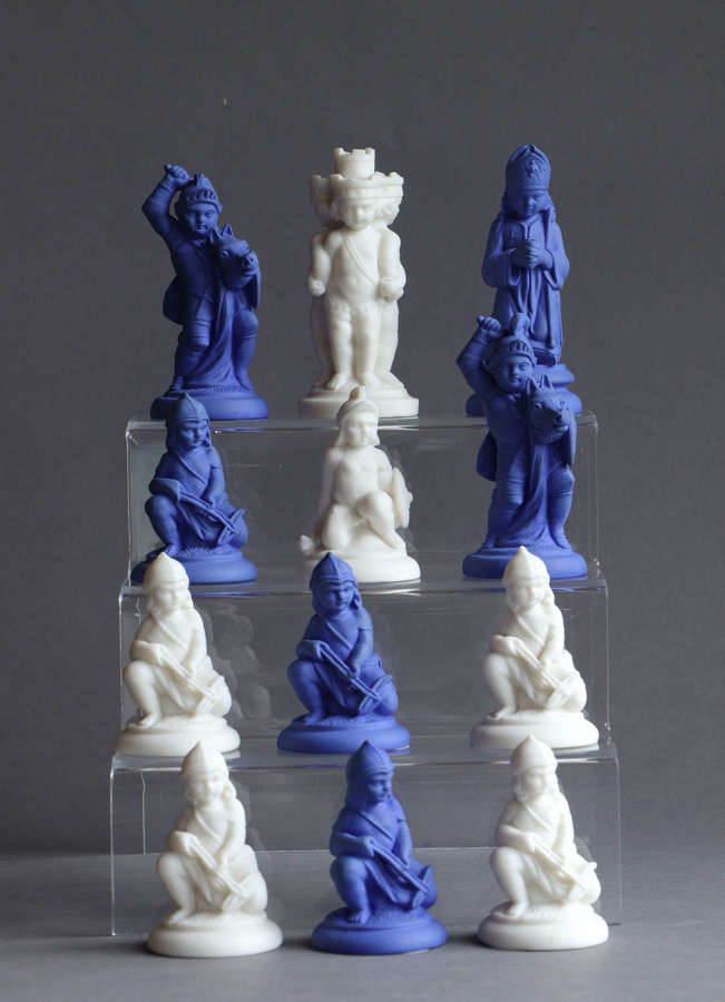A collection of Parian chess pieces by Minton, individually priced