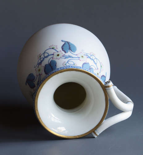 A good Parian jug or pitcher with blue and pink floral decoration