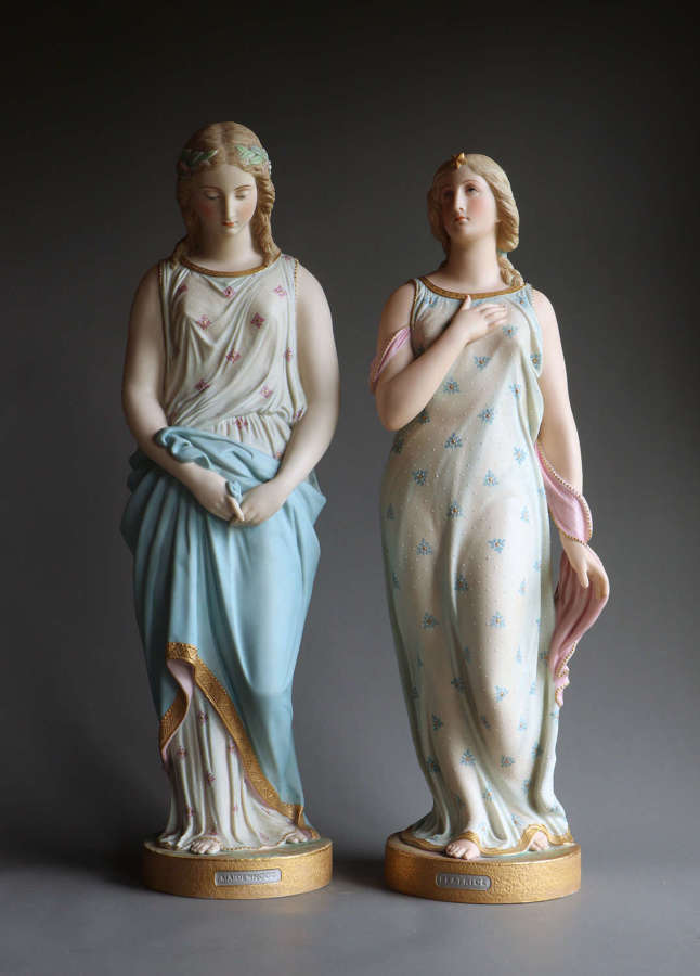A pair of coloured Copeland Parian figures of Beatrice and Maidenhood